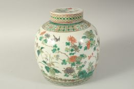 A LARGE CHINESE FAMILLE VERTE PORCELAIN JAR AND COVER, enamel painted with birds and flora, together