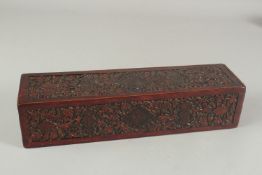 A RARE 18TH CENTURY MUGHAL INDIAN CARVED PAINTED AND LACQUERED WOODEN PEN BOX, 36cm x 9cm.