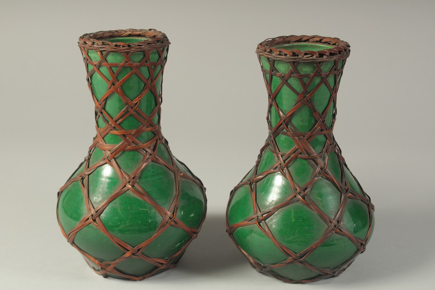 A PAIR OF JAPANESE AWAJI WARE GREEN GLAZED PORCELAIN VASES, with woven bamboo overlay, each with - Image 2 of 4