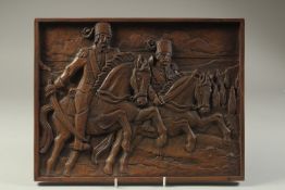 A FINE CARVED WOODEN PANEL, depicting two Ottoman soldiers on horseback, 35cm x 27cm.