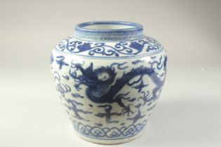 A CHINESE BLUE AND WHITE PORCELAIN DRAGON JAR, 21.5cm high.