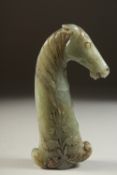 A FINE LATE 19TH CENTURY INDIAN MUGHAL CARVED JADE HORSE HEADED HILT, 12cm long.