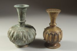 A FINE INDIAN BRONZE BOTTLE VASE, with ribbed body, and another similar bronze vessel, tallest 17.
