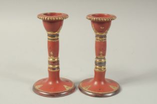 A PAIR OF TURKISH TOPHANE CANDLESTICKS, 18cm high.