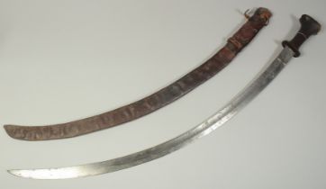 A FINE 18TH-19TH CENTURY ETHIOPIAN RHINO HORN HILTED SWORD, blade with etched portrait of a ruler as