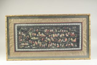 A CHINESE EMBROIDERED SILK 'HUNDRED BOYS' TEXTILE, framed and glazed, textile 31.5cm x 65cm.