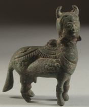 AN UNUSUAL MUGHAL INDIAN BRONZE FIGURE OF A KAMDHENU COW, 9cm long.