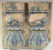 A RARE 18TH CENTURY NORTH INDIAN MUGHAL GLAZED POTTERY TILE, depicting two pillars, 33cm x 30cm.