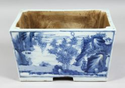 A CHINESE BLUE AND WHITE PORCELAIN RECTANGULAR PLANTER, each side depicting landscape scenes with