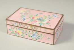 A CHINESE ENAMELLED PINK GROUND RECTANGULAR BOX, finely painted with a bird and butterfly as well as