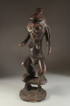 A LARGE 19TH CENTURY AFRICAN CARVED WOOD FIGURE, 59cm high.