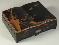A JAPANESE BLACK AND GILT LACQUER GAMING BOX, comprising four lidded compartments containing