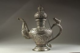 A LARGE CHINESE EMBOSSED AND ENGRAVED WHITE METAL LIDDED JUG, possibly low grade silver, decorated