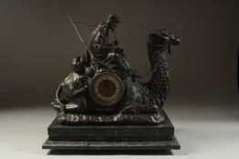 AN ORIENTALIST BRONZE CLOCK IN THE FORM OF A CAMEL WITH ARAB RIDER, mounted to a marble base, 39cm