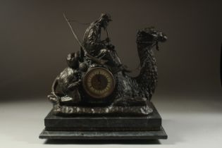 AN ORIENTALIST BRONZE CLOCK IN THE FORM OF A CAMEL WITH ARAB RIDER, mounted to a marble base, 39cm