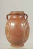 A CHINESE CIZHOU WARE TWIN HANDLE VASE, 17cm high.