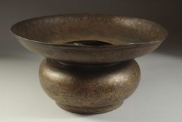 A FINE INDIAN BRASS OR BRONZE BASIN, with silvered floral motif decoration, 34cm diameter.