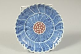 A CHINESE BLUE AND UNDERGLAZE RED FLOWER FORM PORCELAIN DISH, base with character mark, 13.5cm