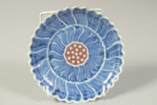 A CHINESE BLUE AND UNDERGLAZE RED FLOWER FORM PORCELAIN DISH, base with character mark, 13.5cm