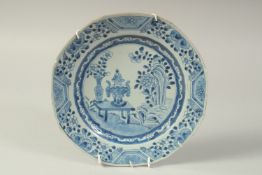 A 19TH CENTURY CHINESE BLUE AND WHITE PORCELAIN PLATE, painted with a floral vase and censer on a