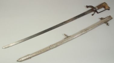 A VERY FINE 19TH CENTURY MOROCCAN RHINO HORN HILTED NIMCHA SWORD, with engraved silver scabbard,