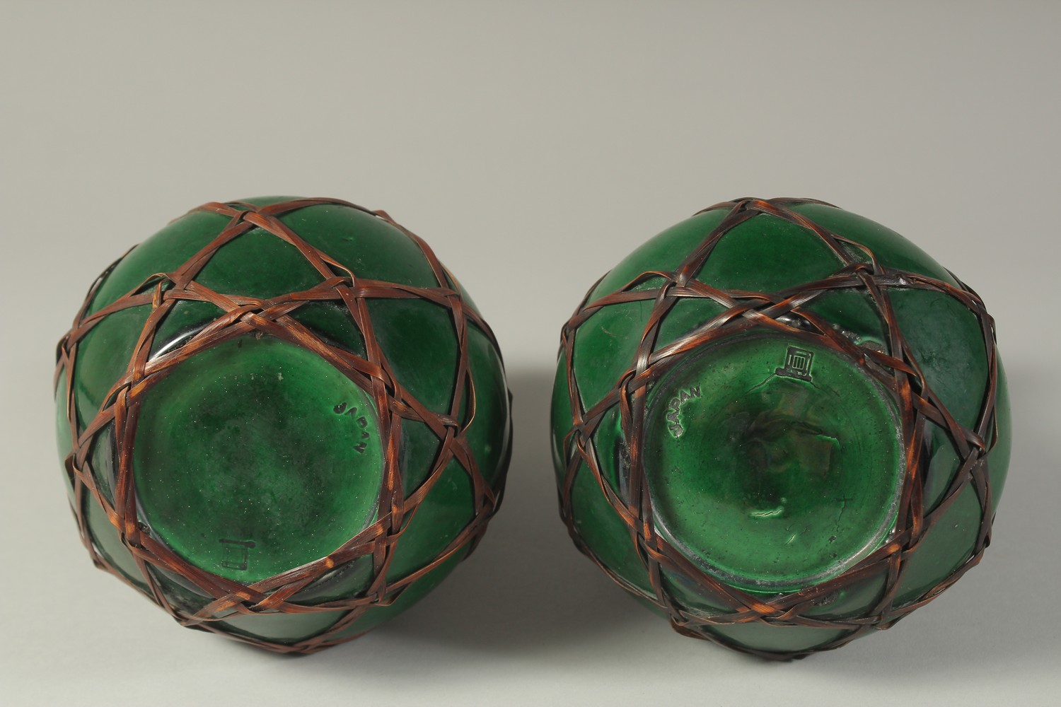 A PAIR OF JAPANESE AWAJI WARE GREEN GLAZED PORCELAIN VASES, with woven bamboo overlay, each with - Image 4 of 4