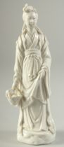 A BLANC DE CHINE PORCELAIN FIGURE, the lady holding a fish in a basket with fine details, 16cm