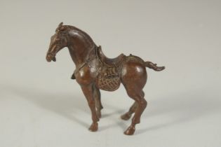 A BRONZE OKIMONO OF A HORSE, 7.5cm long.