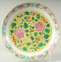 A CHINESE FAMILLE ROSE PORCELAIN FLORAL CHARGER, (af), 36cm diameter.