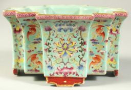 A CHINESE TURQUOISE GROUND FAMILLE ROSE PORCELAIN PLANTER, with fine floral decoration and bats,