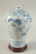 A CHINESE BLUE AND WHITE PORCELAIN MEIPING VASE ON HARDWOOD STAND, decorated with squirrels and