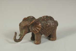 A BRONZE FIGURE OF AN ELEPHANT, 6cm long.