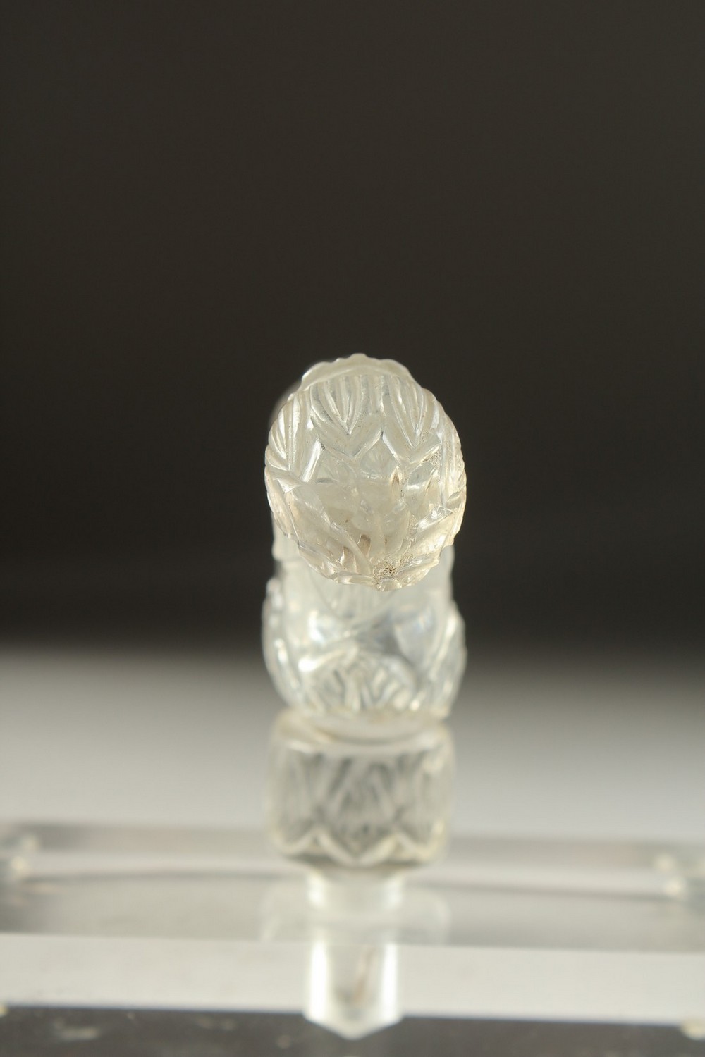 A FINELY CARVED 19TH CENTURY MUGHAL INDIAN ROCK CRYSTAL CRUTCH HANDLE, mounted on a later perspex - Image 3 of 5