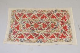 A 20TH CENTURY CENTRAL ASIAN SUZANI EMBROIDERED TEXTILE.