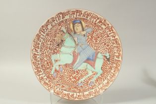 AN ISLAMIC COPPER LUSTRE CHARGER MADE FOR THE CHINESE MARKET, painted with a figure on horseback,