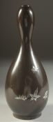 A FINE JAPANESE MEIJI PERIOD SIGNED DOUBLE GOURD BRONZE VASE, inlaid with silver leaves, signed to