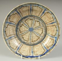 A FINE 16TH-17TH CENTURY PERSIAN OR CENTRAL ASIAN SAFAVID KUBACHI TYPE GLAZED POTTERY DISH, 26.5cm
