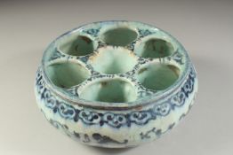 A FINE 16TH-17TH PERSIAN SAFAVID GLAZED POTTERY SECTIONAL BOWL, 22cm diameter.