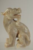 A LARGE CHINESE CARVED SOAPSTONE FOO DOG, 17.5cm high.