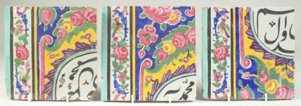 A COLLECTION OF THREE 19TH CENTURY PERSIAN QAJAR GLAZED POTTERY TILES, painted with calligraphy,