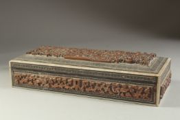 A 19TH CENTURY ANGLO INDIAN BONE INLAID CARVED WOODEN BOX, 29cm long.