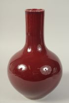 A LARGE CHINESE SANG DE BOEUF VASE, the base with character mark, 34cm high.