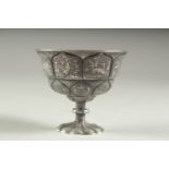 A VERY FINE CHINESE SILVER STEM CUP, embossed and chased with scenes of animals, 6cm high, 7.5cm