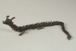 AN ARTICULATED BRONZE OKIMONO OF A DRAGON, 38cm long outstretched.