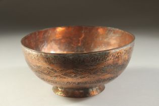 A 19TH CENTURY QAJAR ENGRAVED TINNED COPPER BOWL, 19.5cm diameter.