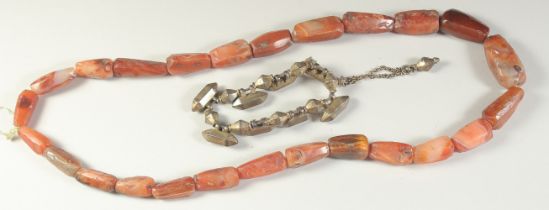 A POSSIBLY ANCIENT AGATE BEADED NECKLACE, along with a Mughal Indian gilt metal bracelet, with