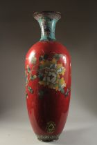 A VERY LARGE AND FINE RED GROUND CLOISONNE ENAMEL VASE, the neck decorated with lion dogs on blue
