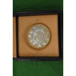A Bulgari silver gaming chip/coin with original box.