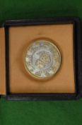 A Bulgari silver gaming chip/coin with original box.