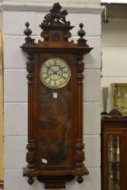 A Victorian walnut Vienna wall clock.